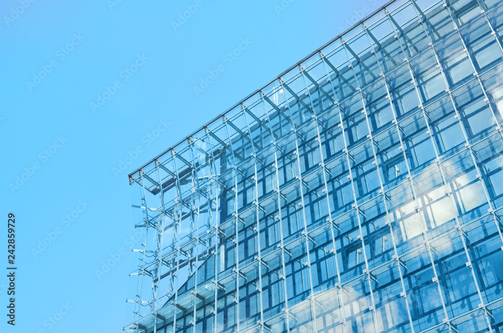 Detail of blue glass city corporate building.