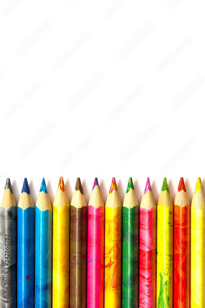 many color pencils on a white background many color pencils on a white background