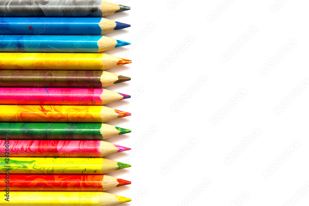 many color pencils on a white background copy space