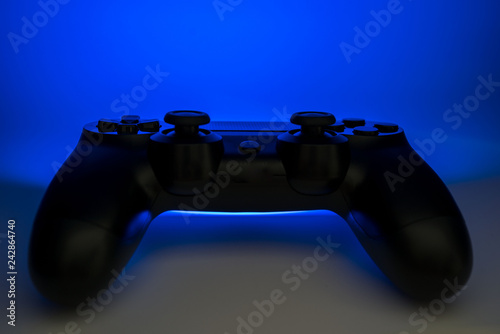 Video game controller with blue light emitting