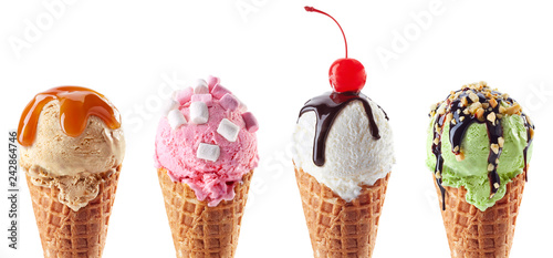Photo Set of four various ice cream scoops in waffle cones