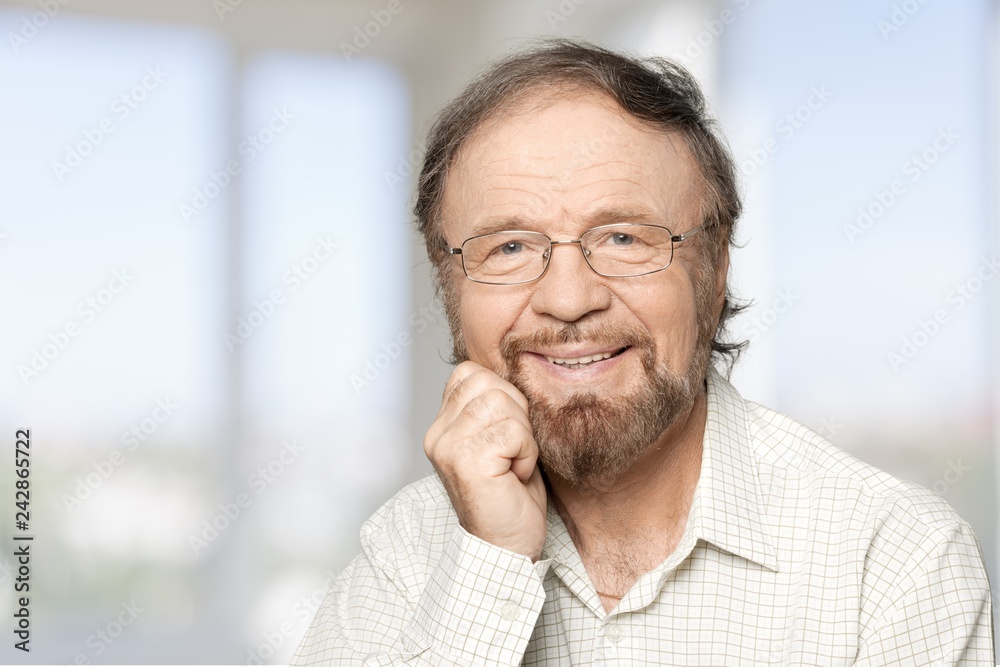 Senior business man in grey suit on light background Senior business man in grey suit on light background