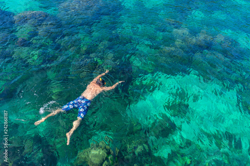 Traveler diving in the sea at Phuket, Thailand.