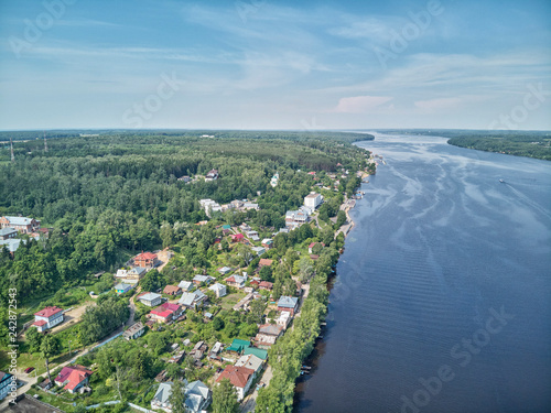 A view of the Volga River from the Levitan Mountain in the autumn Plyos and the Varvara Church photo