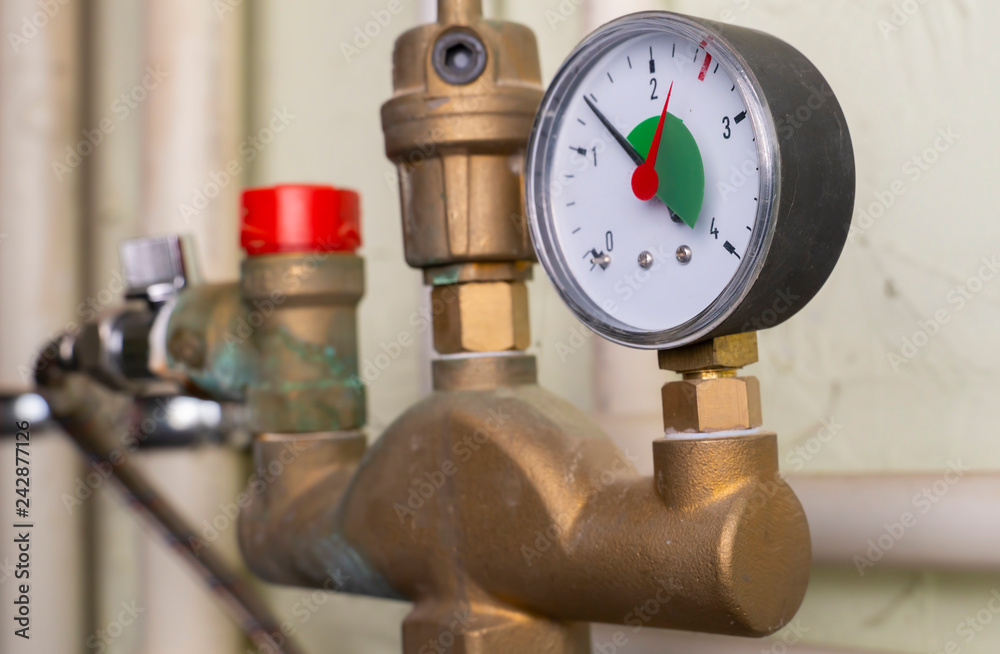 Manometer shows pressure in plumbing in basement. close-up. Manometer shows pressure in plumbing in basement. close-up.