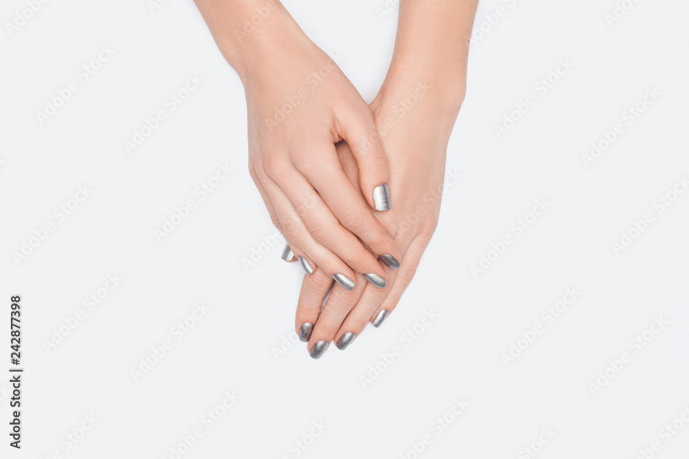 Fototapeta premium top view of female hands isolated on white