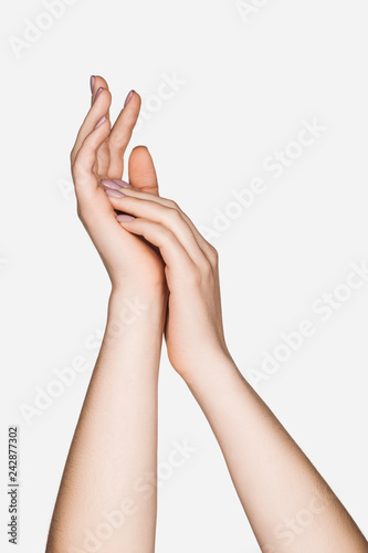 cropped view of female hands isolated on white