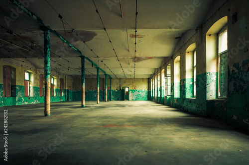 Dark interior inside abandoned old factory building 
