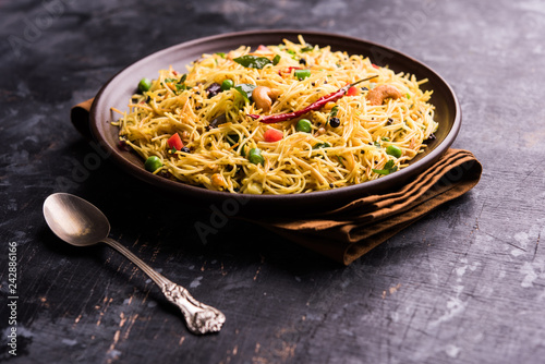 Semiya Upma or Vermicelli Uppuma or uppittu is a popular breakfast menu from south India. served in a bowl. selective focus photo