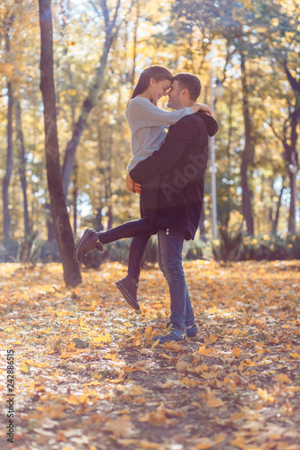 Natural photos of a happy couple in love having fun outside on a sunny autumn day. Togetherness and happiness concept © Gorodetskaya
