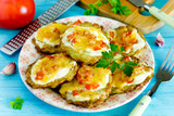 Zucchini fritters with sour cream, tomatoes and cheese