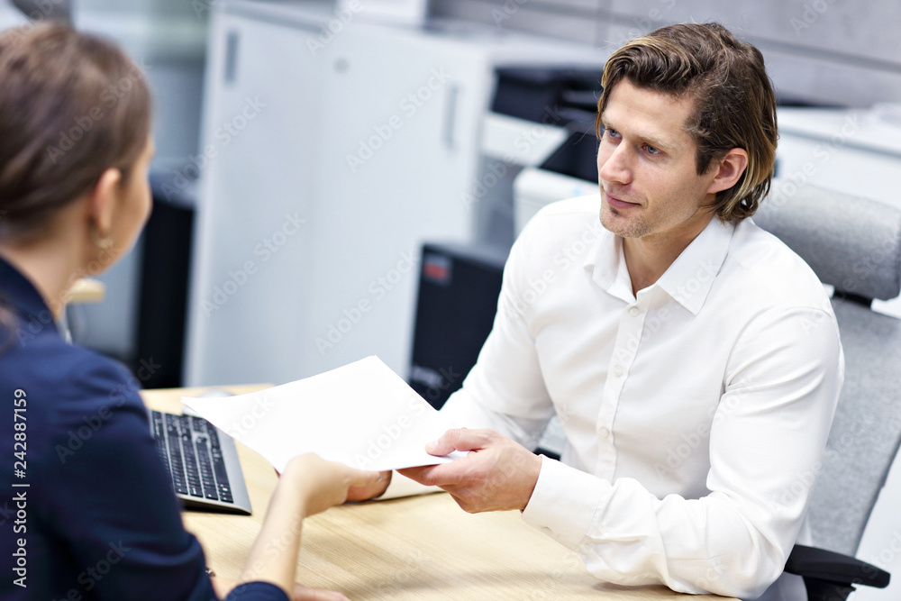 Adult couple in the office with real estate agent Adult couple in the office with real estate agent