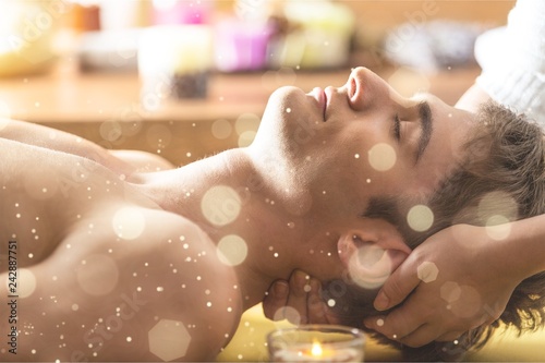 Young man relaxed in spa ,Closeup of a man having head massage