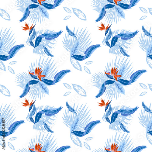 Seamless pattern of tropical  palm leaves  monstera  leaves  and coral flowers of the bird of paradise  Strelitzia  plumeria. Wallpaper trend design.