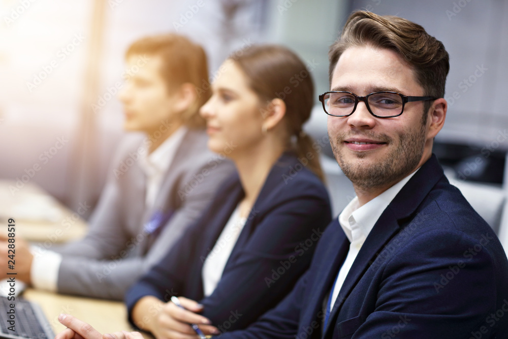Group of business people attending a conference Group of business people attending a conference