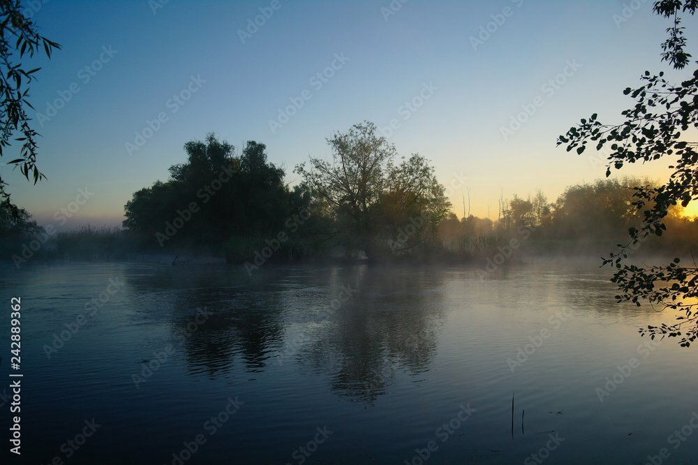 Morning landscape with fog on the river