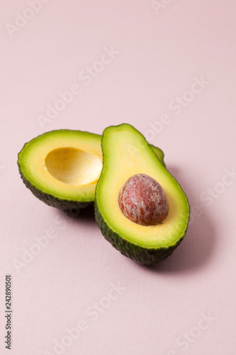 An avocado sliced in half with the stone in place