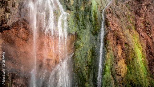 Colorful Waterfall within the National Park of Plitvive Lakes in Croatia photo