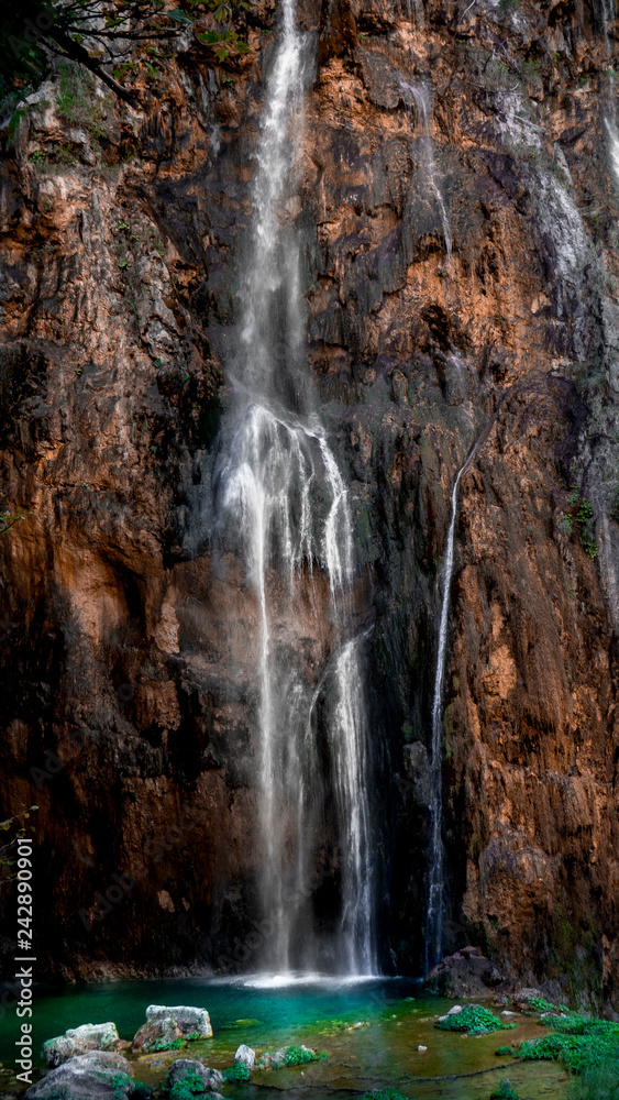 Fototapeta premium Colorful Waterfall within the National Park of Plitvive Lakes in Croatia