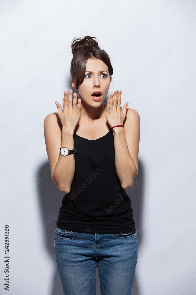Portrait of amazed young woman over white background Portrait of amazed young woman over white background