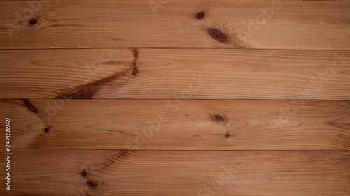 Brown wood texture. Wall of the wooden house.