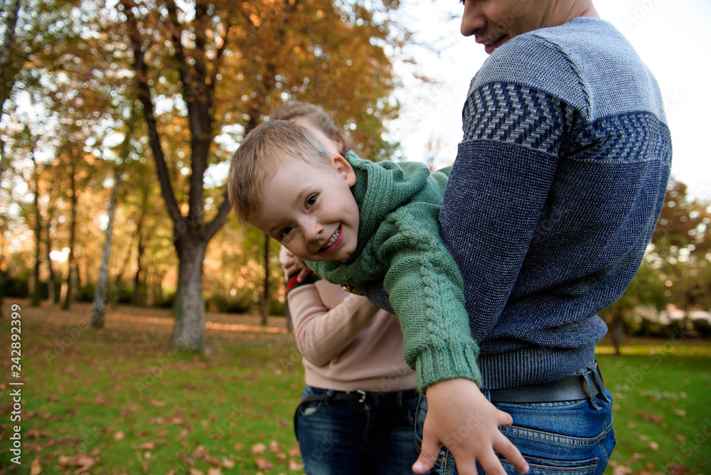Fototapeta premium Happy family resting in beautiful autumn park