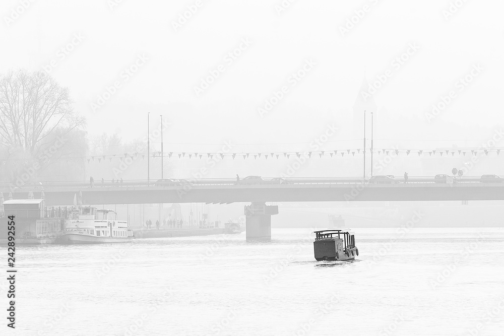 Bridge in Krakow in foggy day (Poland). Black and White version.
