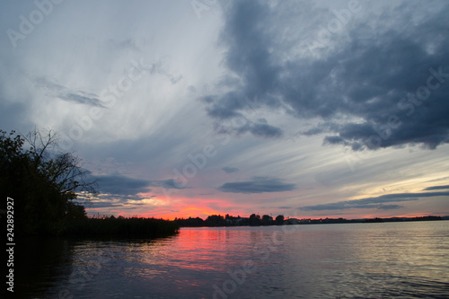 Colorful sky and colorful water in lake reflected in evening © Елена Писак