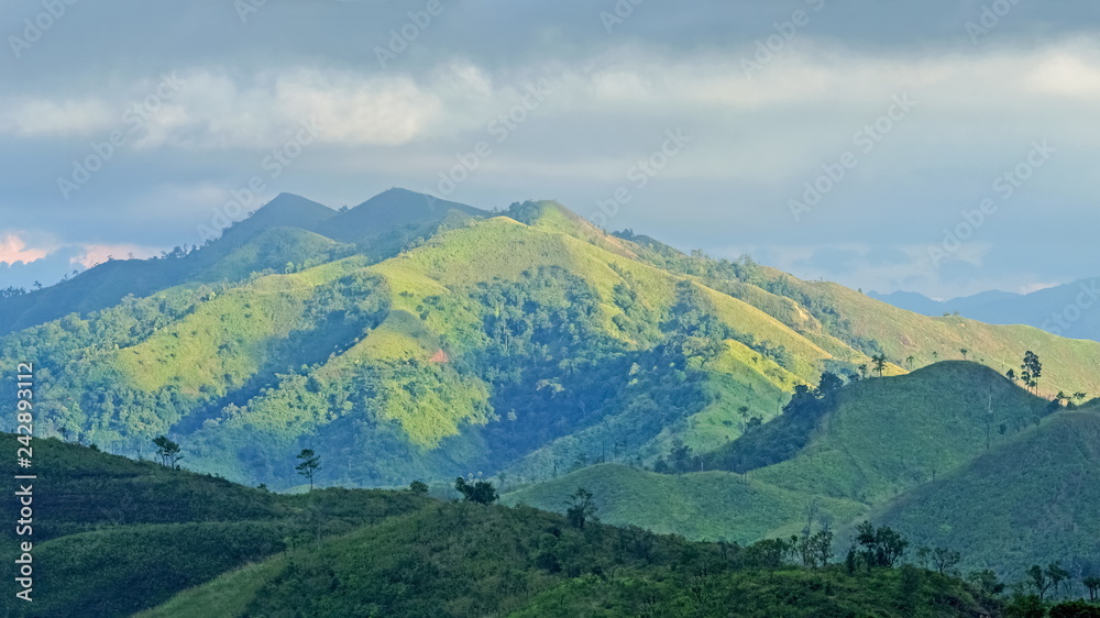 view of Khao Chang Puek known as white elephant mountain, beautiful green forest and high mountain with cloudy sky background, Thong Pha Phum National Park, Thong Pha Phum, Kanchanaburi, Thailand.
