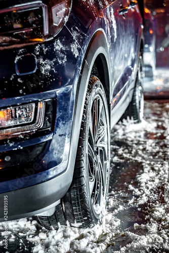 Car with winter tires on the stand, winter time, snow and ice photo