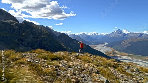 Aerial Caucasian hiker hiking Mount Aspiring New Zealand photo