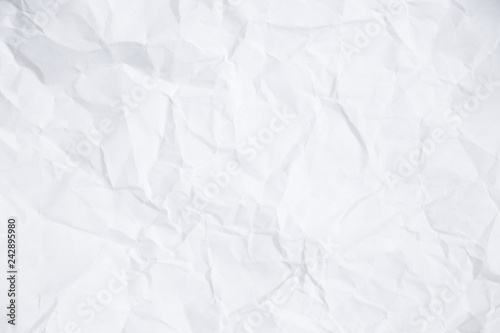 Texture of a rumpled white sheet of paper. Empty background. Option number one. Background for design and typography.