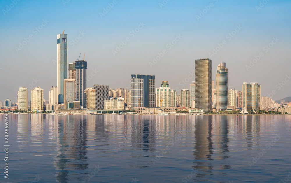 Panorama of the city skyline of Xiamen in China with artificial ocean reflection