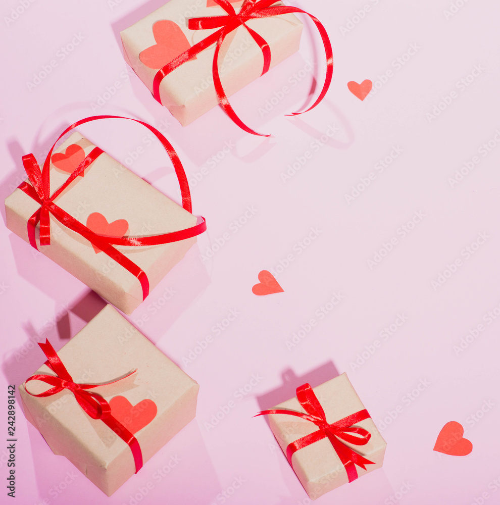 Valentine's Day gift on a pink background lie with a red ribbon hearts with love frame place for text isolate Valentine's Day gift on a pink background lie with a red ribbon hearts with love frame place for text isolate