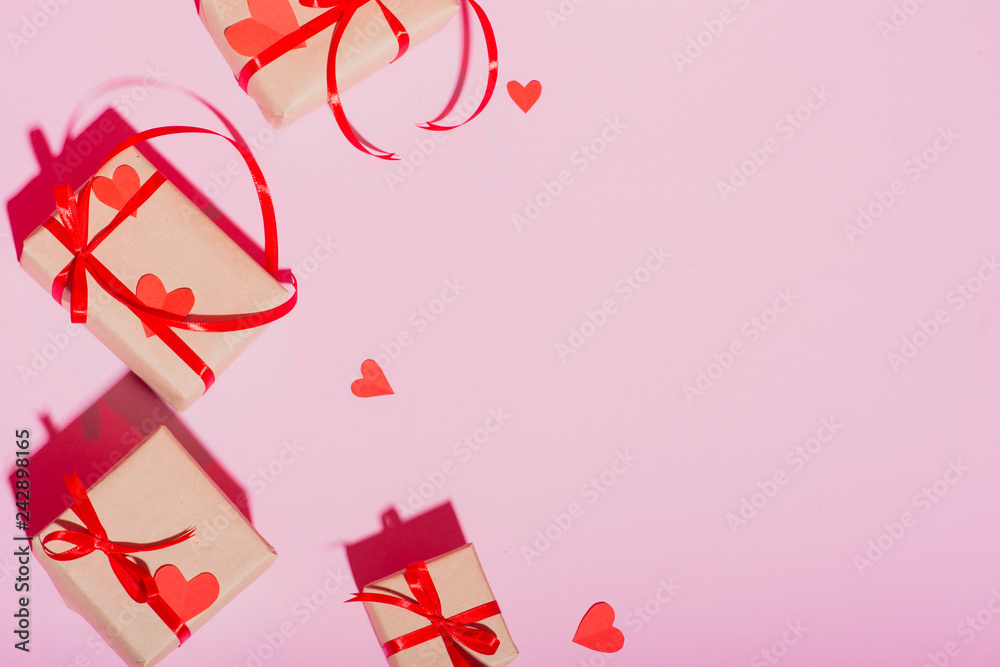 Valentine's Day gift on a pink background lie with a red ribbon hearts with love frame place for text isolate Valentine's Day gift on a pink background lie with a red ribbon hearts with love frame place for text isolate