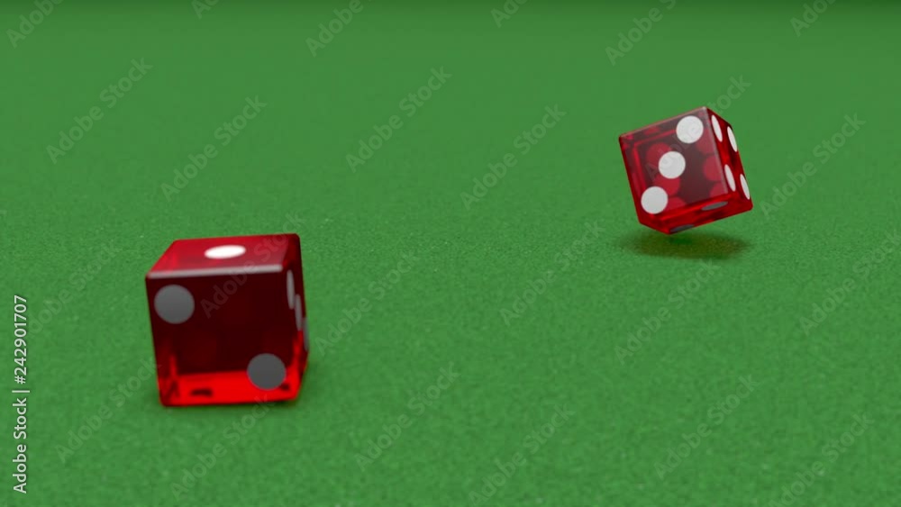 Slow motion craps dice on casino green felt craps table