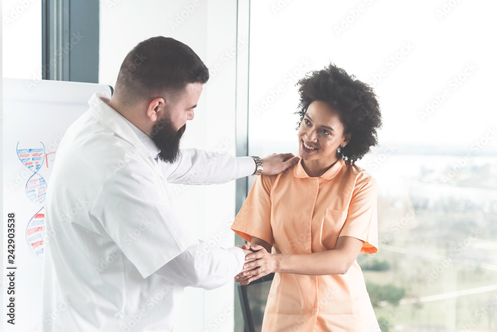 Colleague doctors handshaking Colleague doctors handshaking