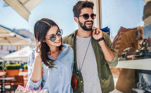 Young couple in shopping. Consumerism  love  dating  lifestyle concept