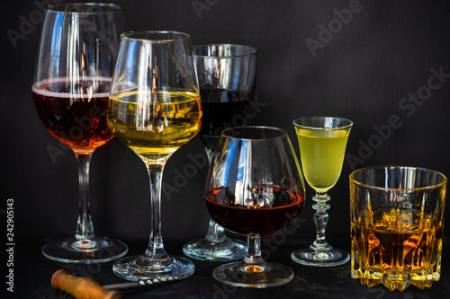 Glassed with drinks on dark background