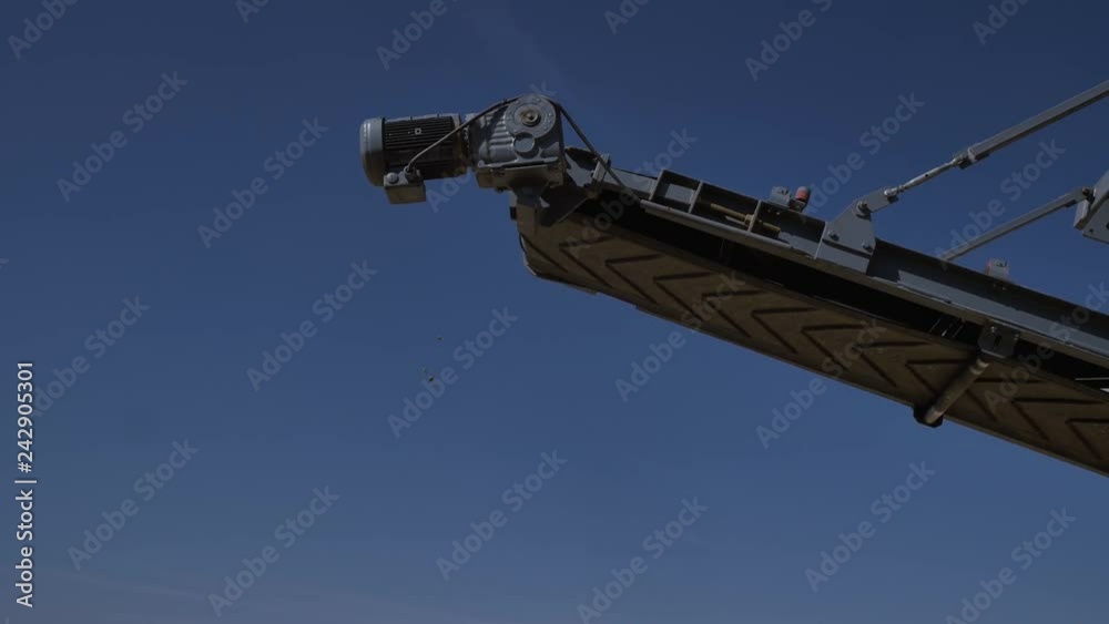 Separation of sand in construction industry. Process refinement of sand for concreting. Low angle view. Close up Separation of sand in construction industry. Process refinement of sand for concreting. Low angle view. Close up