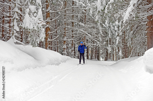 Cross-country skiing. Young man doing outdoor exercise. Winter sport and healthy lifestyle. © Alena