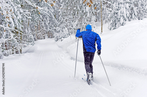 Cross-country skiing. Young man doing outdoor exercise. Winter sport and healthy lifestyle.