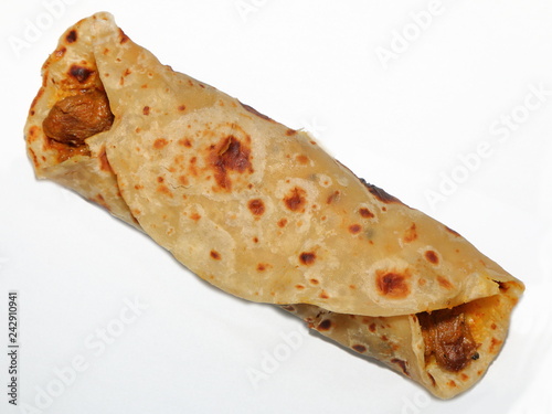 Close-up of a lamb roti roll - an Indian bread with lamb curry as a filling, a popular Indian dish / takeaway food in South Africa