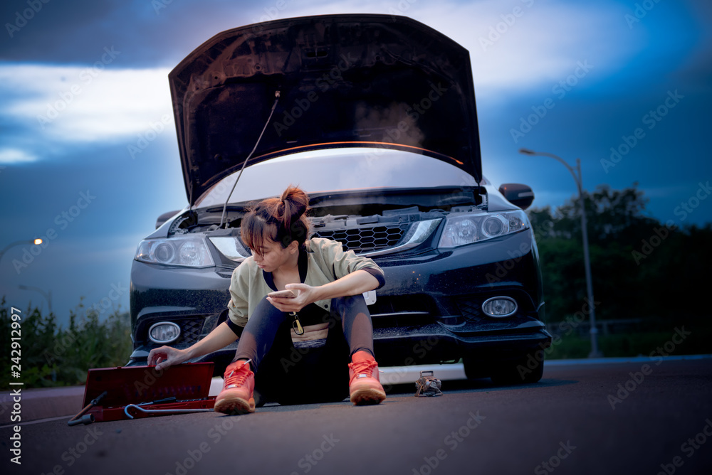 young woman in trouble on the car engine break down, engine over heat ...