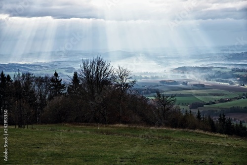 Dark landscape with sun rays, Czech paradise, Czech republic.