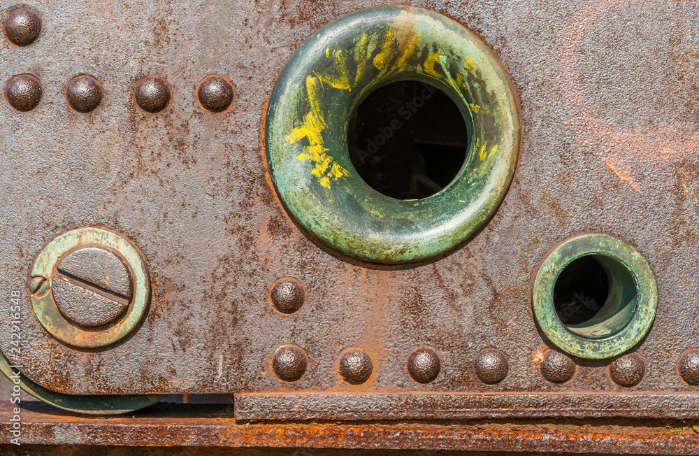 Texture of rusted steel and rivets.