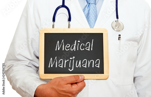 Medical Marijuana, doctor holding chalkboard with text, white background