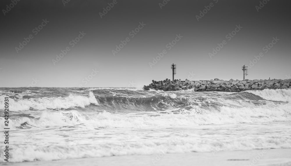 Lighthouse and storm at sea