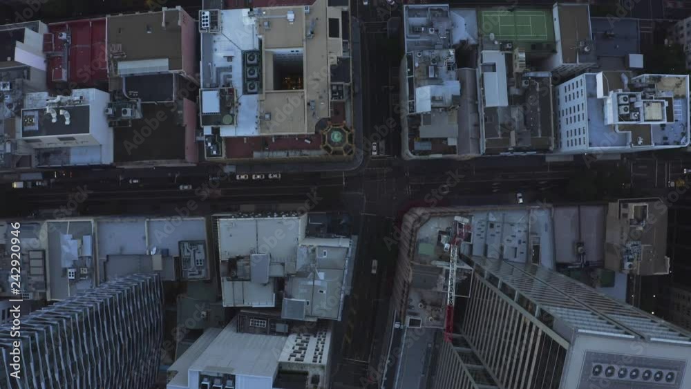 City streets at dusk as seen from above. Aerial view of city streets and intersections City streets at dusk as seen from above. Aerial view of city streets and intersections