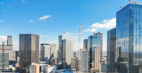 Panorama aerial view of downtown Dallas, Texas during sunny autumn day with colorful fall foliages